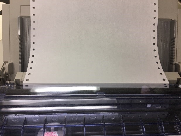 Image of dot matrix printer and paper