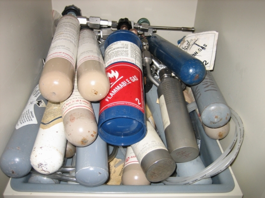 lecture bottles piled on top of each other