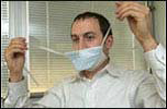 man putting on surgical mask